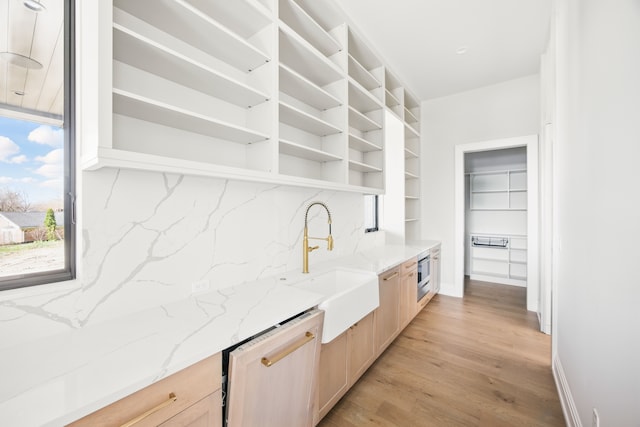 3281 Chickering Ln, Bloomfield Hills, MI 48302 - bar with dishwasher, a sink, light wood-style flooring, tasteful backsplash, and stainless steel oven