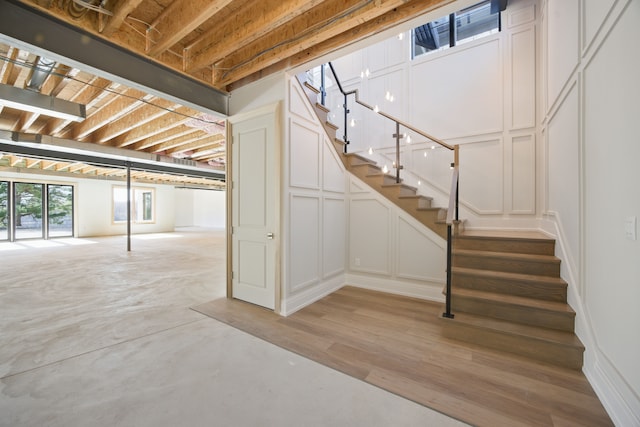 below grade area featuring a decorative wall and stairway