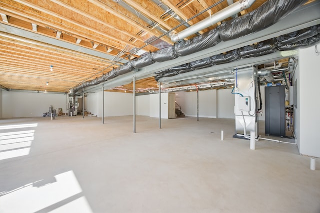 unfinished basement featuring heating unit and stairway