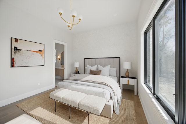 3281 Chickering Ln, Bloomfield Hills, MI 48302 - bedroom with a chandelier, wood finished floors, baseboards, and connected bathroom