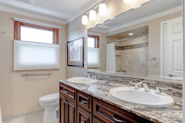 full bathroom with a sink, tiled shower, and a wealth of natural light