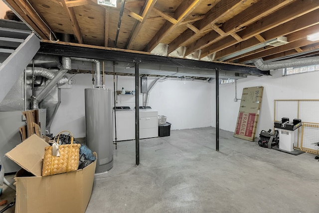 unfinished basement featuring gas water heater and washing machine and dryer