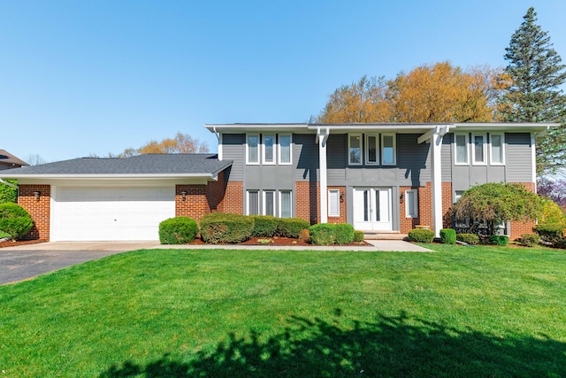 view of front of home featuring brick siding, an attached garage, and driveway