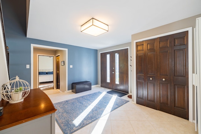 foyer with light tile patterned floors