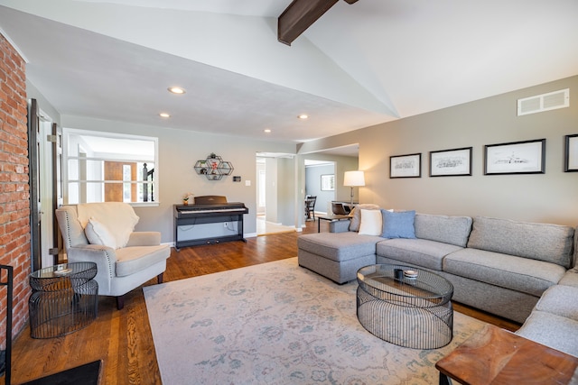 living area featuring lofted ceiling with beams, recessed lighting, wood finished floors, and visible vents