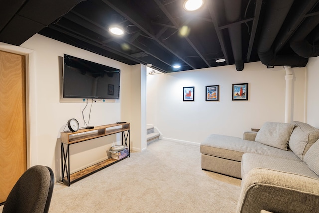 living room featuring carpet flooring, baseboards, and stairs