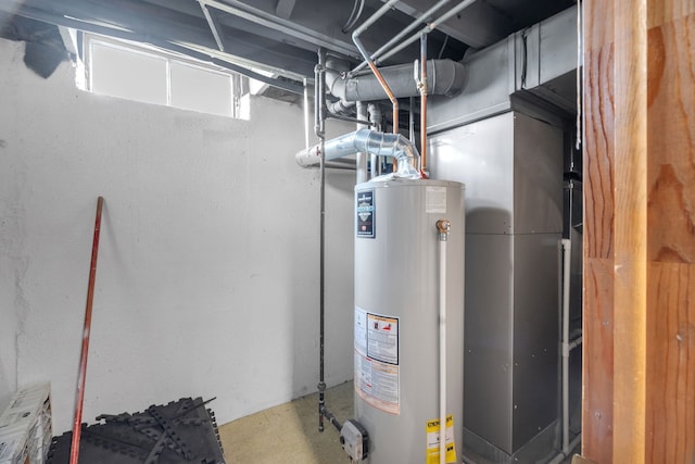 utility room with gas water heater