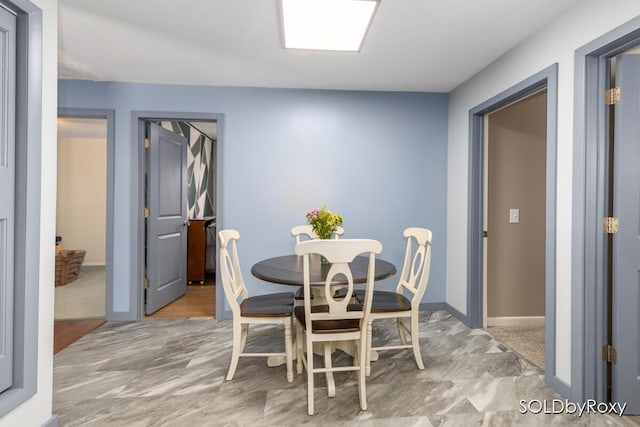 dining room featuring baseboards