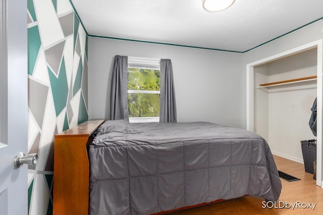 bedroom with wood finished floors