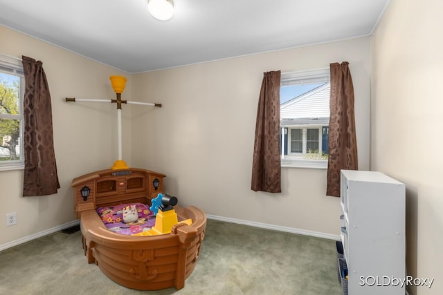 bedroom featuring baseboards and carpet flooring