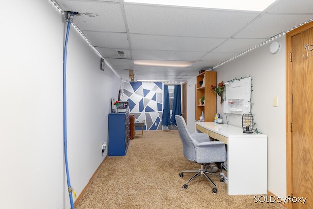 home office with visible vents, carpet flooring, and a paneled ceiling