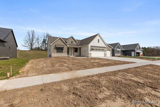 view of front of house with a garage, board and batten siding, and concrete driveway