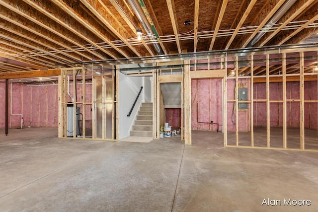 unfinished below grade area with stairs, water heater, and electric panel