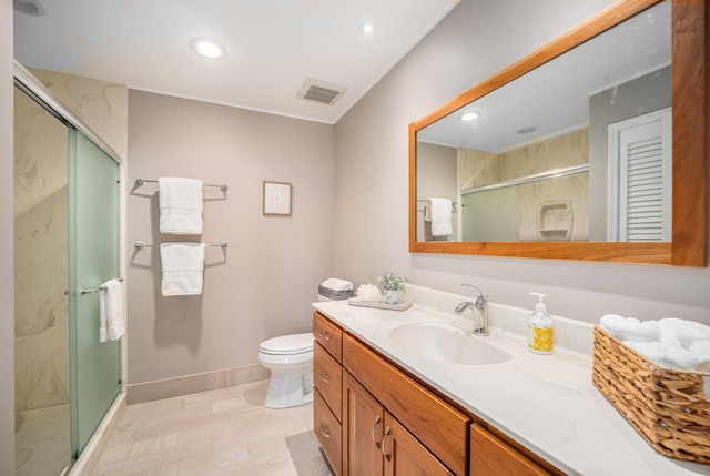 bathroom featuring visible vents, vanity, baseboards, recessed lighting, and a shower stall