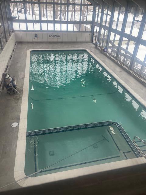 view of pool featuring a pool with connected hot tub