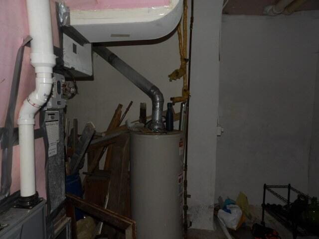 utility room with gas water heater