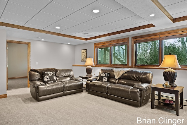 carpeted living room featuring a baseboard radiator, a raised ceiling, baseboards, and recessed lighting