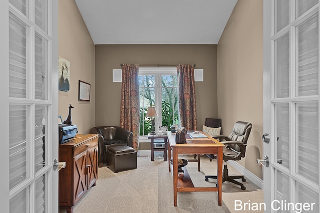 home office featuring light colored carpet, baseboards, and french doors