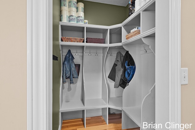 mudroom with wood finished floors