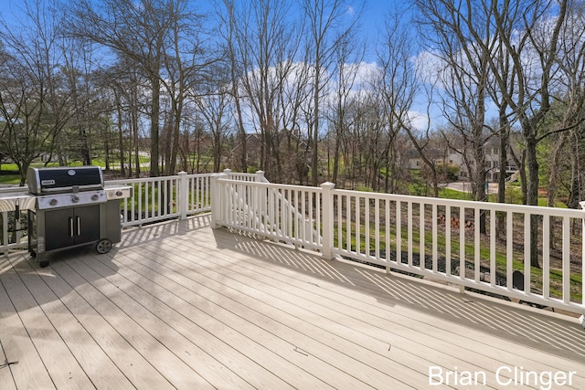 wooden terrace featuring grilling area