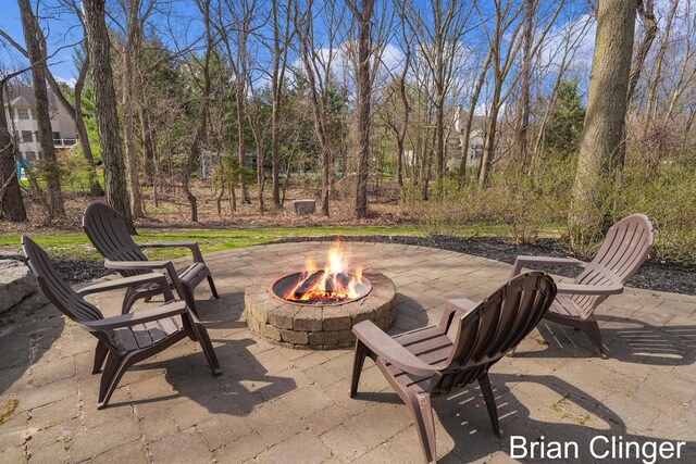 view of patio / terrace featuring an outdoor fire pit