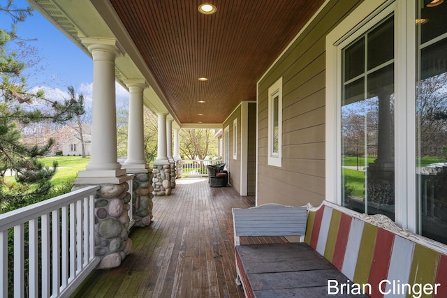 wooden deck featuring covered porch
