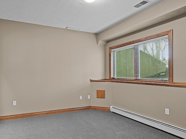 carpeted empty room featuring a textured ceiling, baseboards, visible vents, and a baseboard radiator