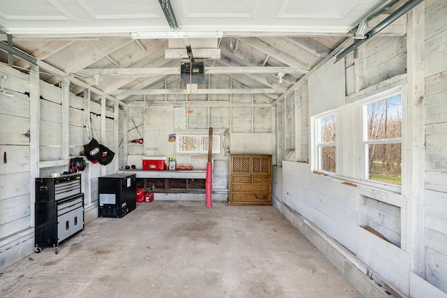 garage featuring a workshop area and a garage door opener