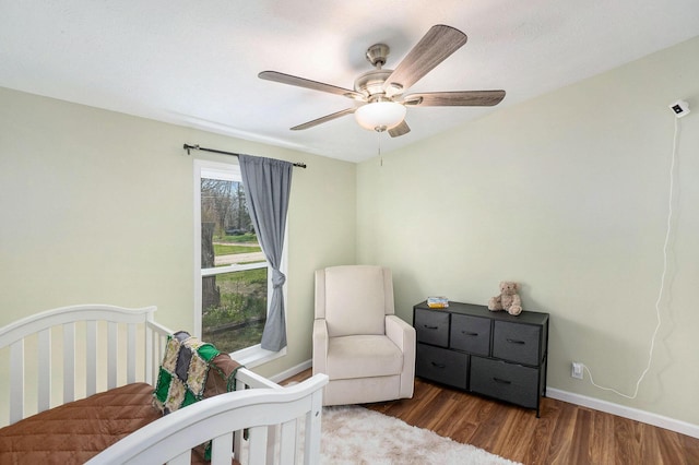 bedroom with baseboards, a ceiling fan, and wood finished floors