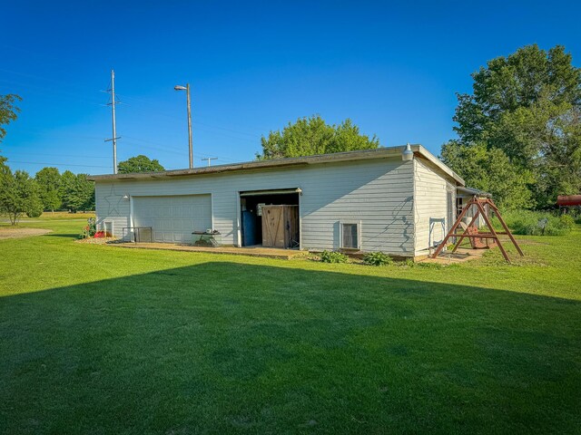 50002 M 51 N, Dowagiac, MI 49047 - rear view of house with a lawn, an outdoor structure, and a detached garage