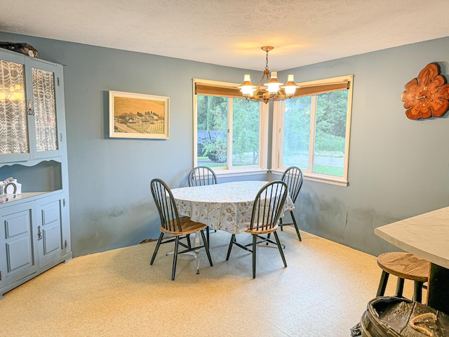 50002 M 51 N, Dowagiac, MI 49047 - dining area featuring a textured ceiling and an inviting chandelier