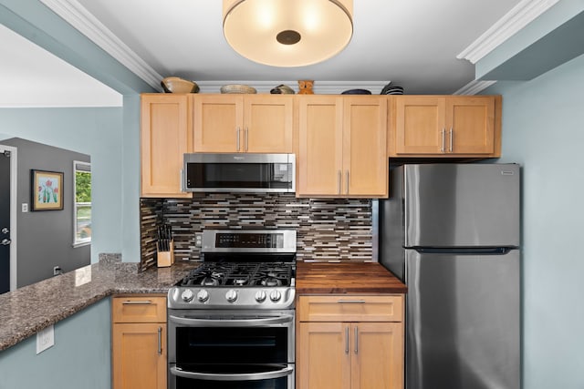 kitchen featuring light brown cabinetry, appliances with stainless steel finishes, decorative backsplash, and ornamental molding
