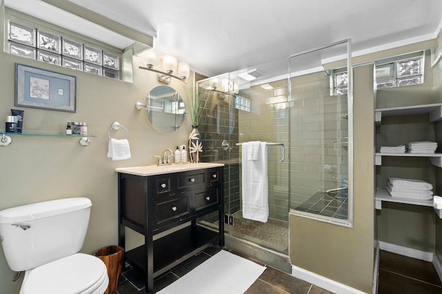 full bath featuring vanity, toilet, tile patterned floors, a shower stall, and a wealth of natural light