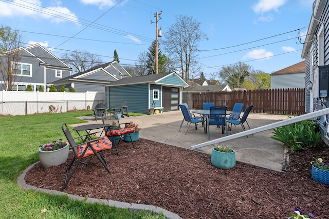 view of patio featuring a fenced backyard and an outdoor structure