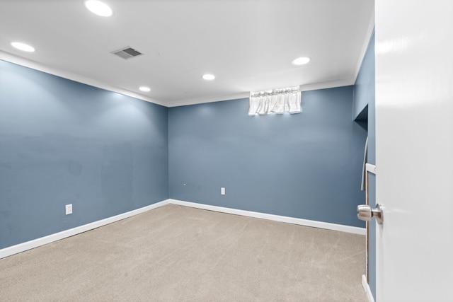 finished basement with visible vents, recessed lighting, baseboards, and carpet flooring