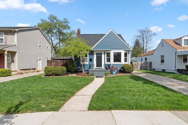bungalow-style home with fence, a chimney, and a front yard