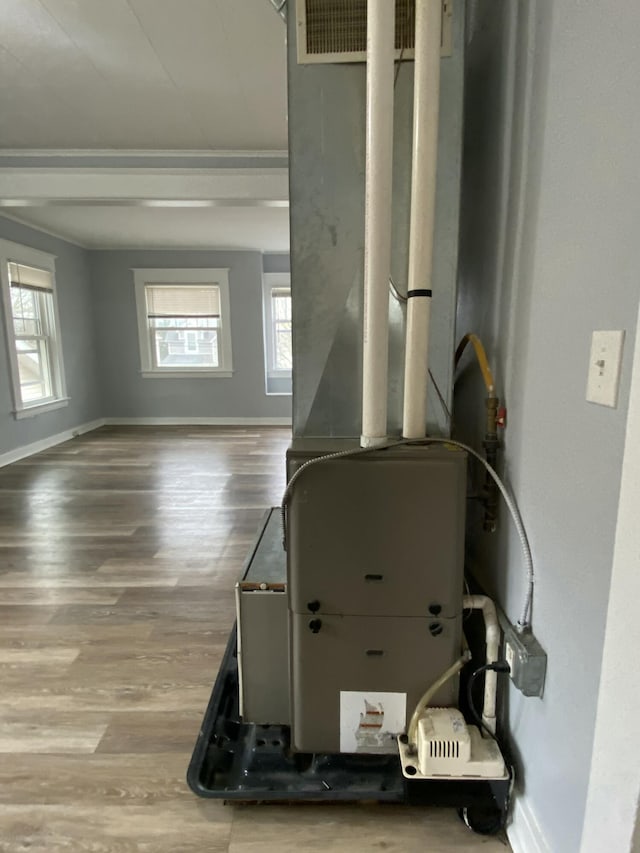 utility room with heating unit