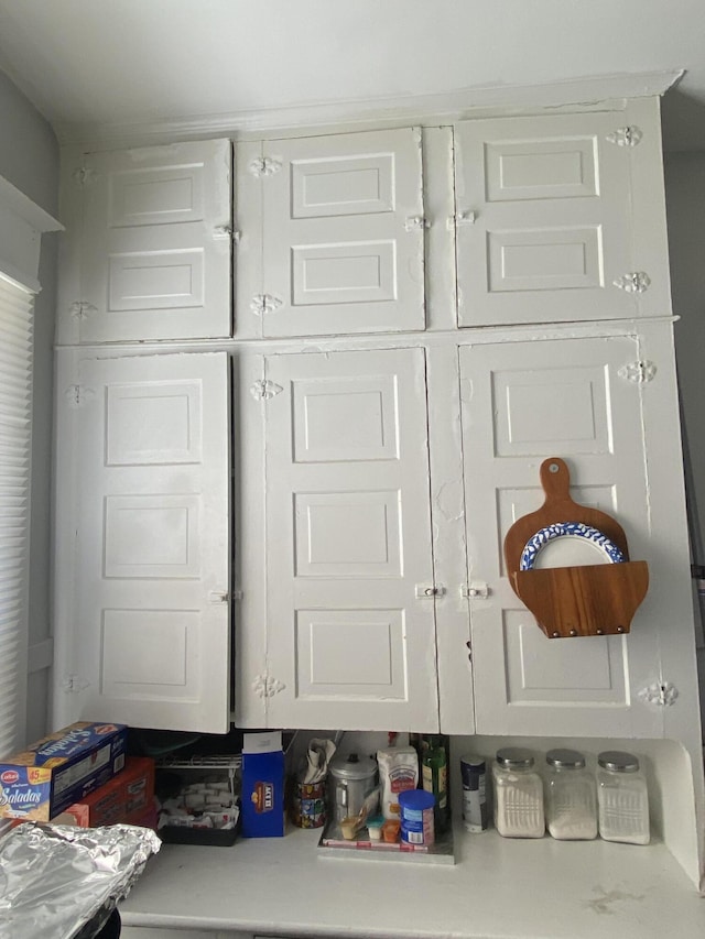 details featuring light countertops and white cabinets