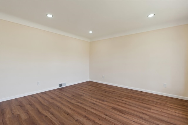 empty room featuring recessed lighting, baseboards, and visible vents