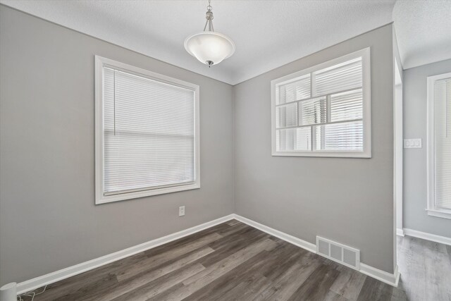 9119 Seminole, Redford, MI 48239 - spare room featuring visible vents, dark wood finished floors, and baseboards