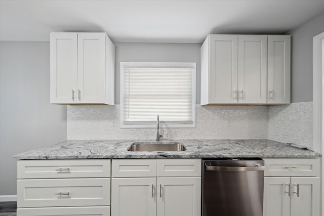 9119 Seminole, Redford, MI 48239 - kitchen featuring light stone countertops, a sink, white cabinetry, tasteful backsplash, and stainless steel dishwasher