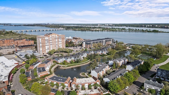 aerial overview of property's location featuring a notable bridge, a nearby body of water, and apartment complex / building
