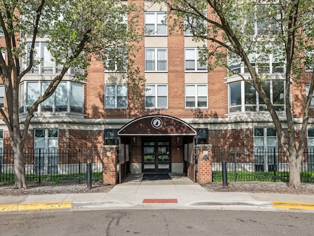 view of building exterior with a fenced front yard