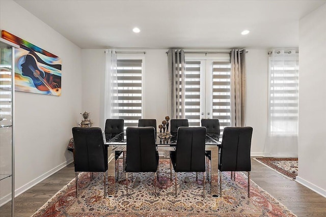 dining room with baseboards, recessed lighting, and wood finished floors