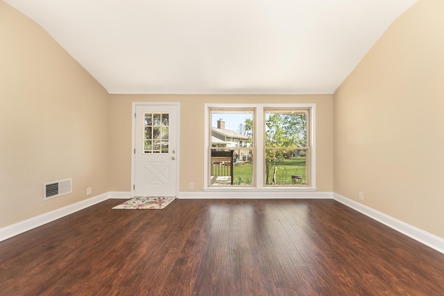 spare room with baseboards, plenty of natural light, and visible vents