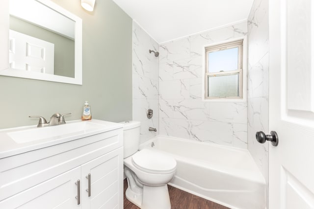 bathroom with vanity, wood finished floors, bathing tub / shower combination, and toilet