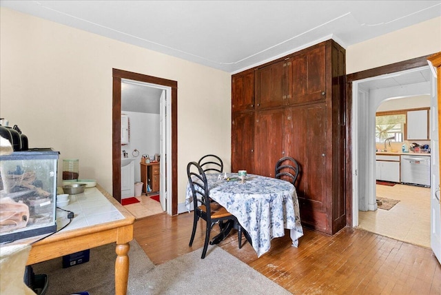 dining space featuring light wood-style flooring