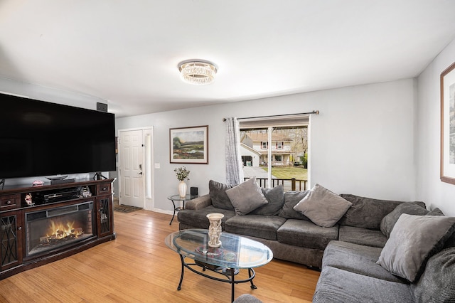 5184 Denwood St, Waterford, MI 48327 - living room featuring baseboards and light wood-type flooring