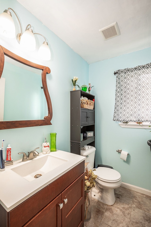 5184 Denwood St, Waterford, MI 48327 - half bath featuring visible vents, baseboards, toilet, and vanity