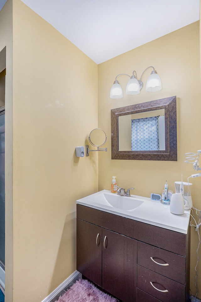 5184 Denwood St, Waterford, MI 48327 - bathroom featuring baseboards and vanity